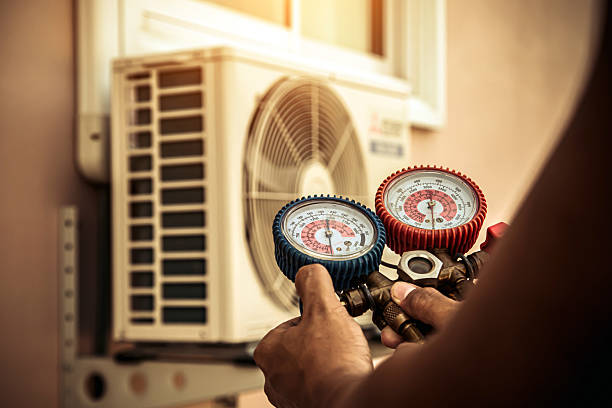 Professional Air Conditioning Service technician working in Rolla, ND